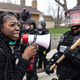 A woman confronts police officers standing in line as protesters gather after an officer shot and killed a black man in Brooklyn Center, Minneapolis, Minnesota on April 11,2021.